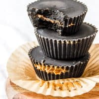 DETOX FUDGE CUPS - Not only are these paleo treats packed with healthy fats from cacao butter but they're also packed with a secret ingredient that makes them black and helps your body flush out toxins!