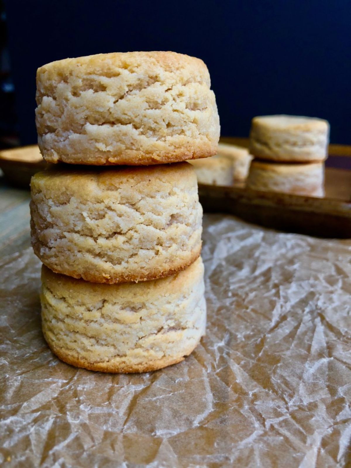a stack of 3 biscuits, with more in a tray behind