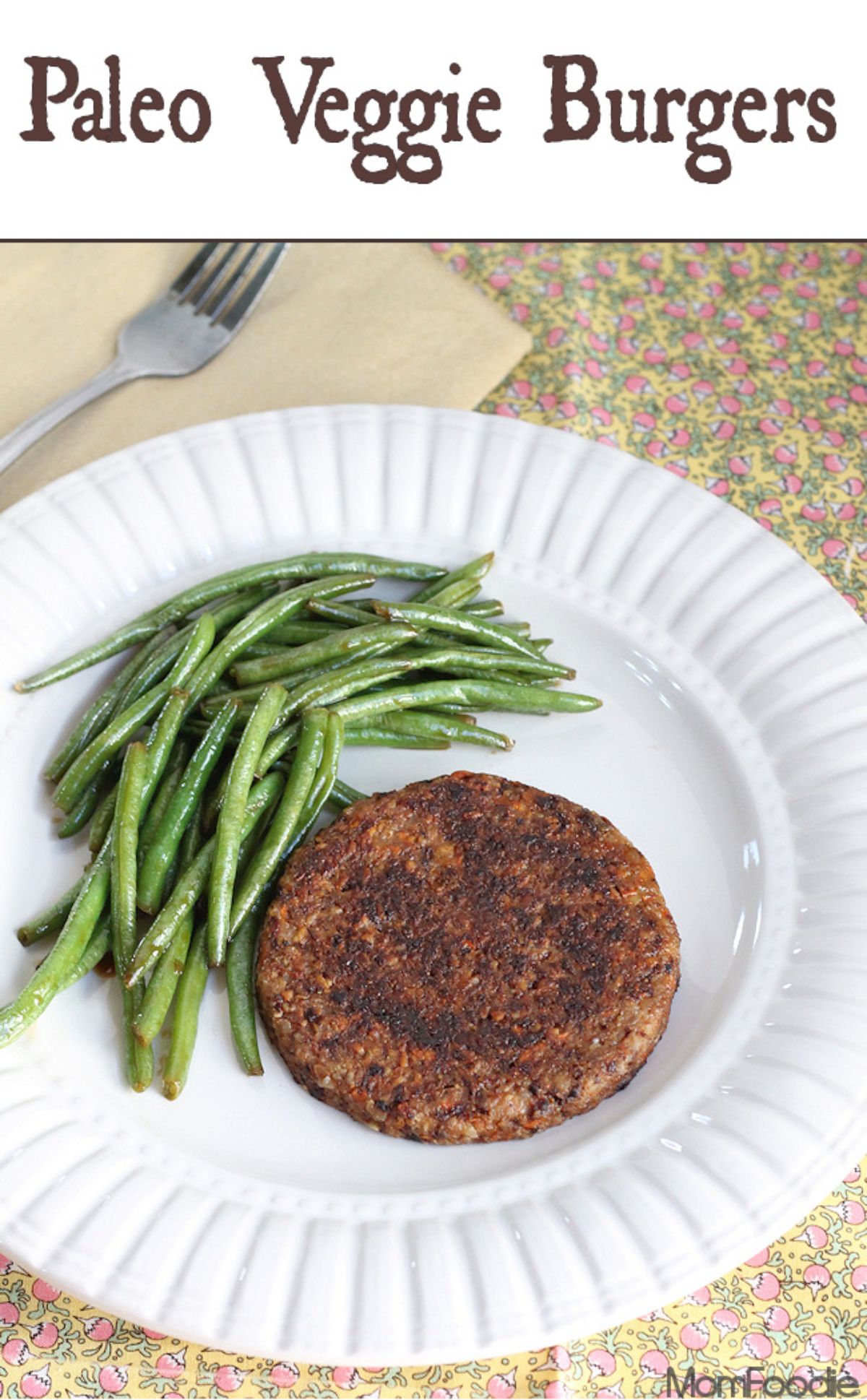 The text reads "Paleo Veggie Burgers". The photo is a white plate with green beans and a veggie burger on it