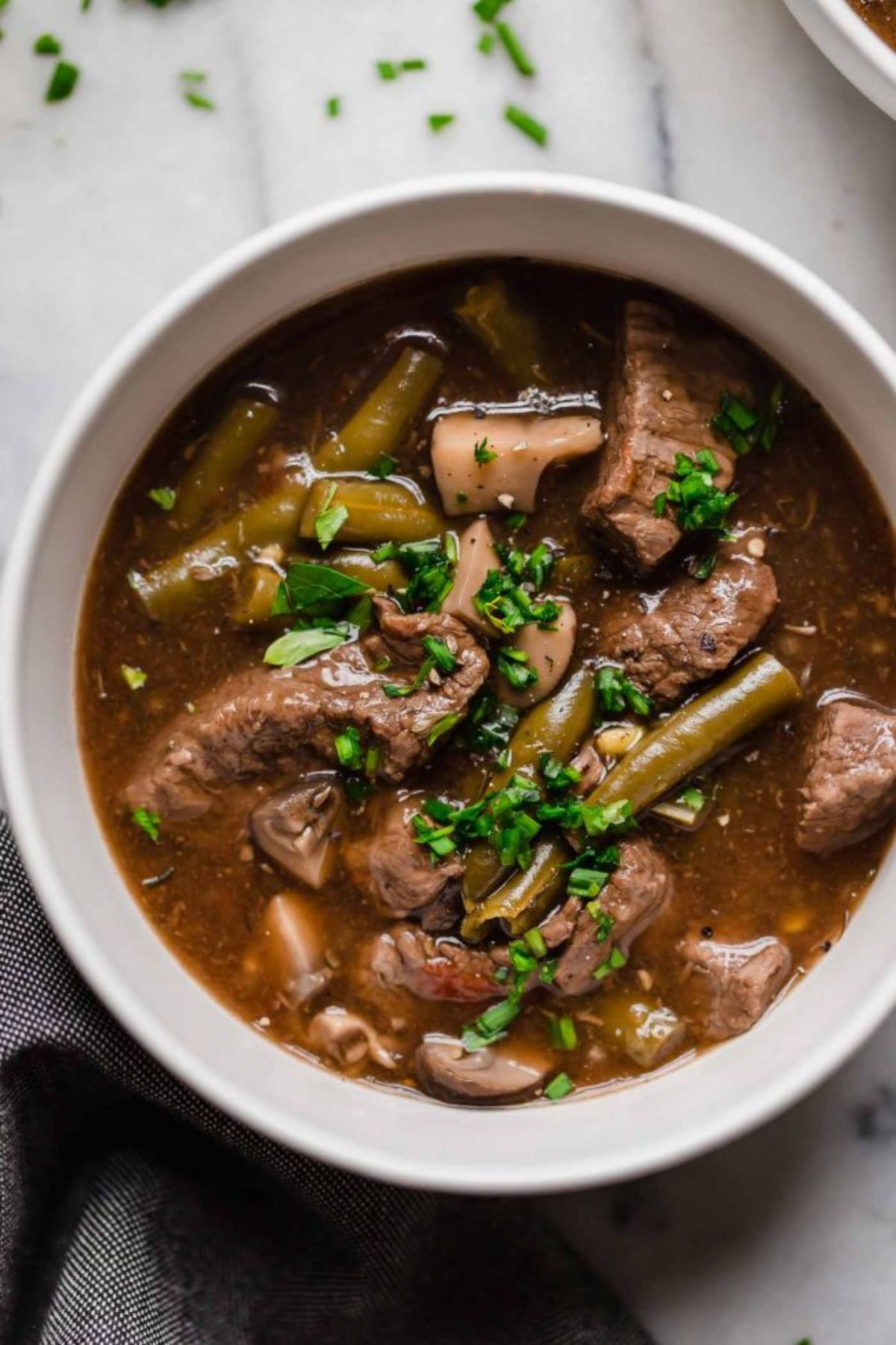 beef stew in a round white bowl