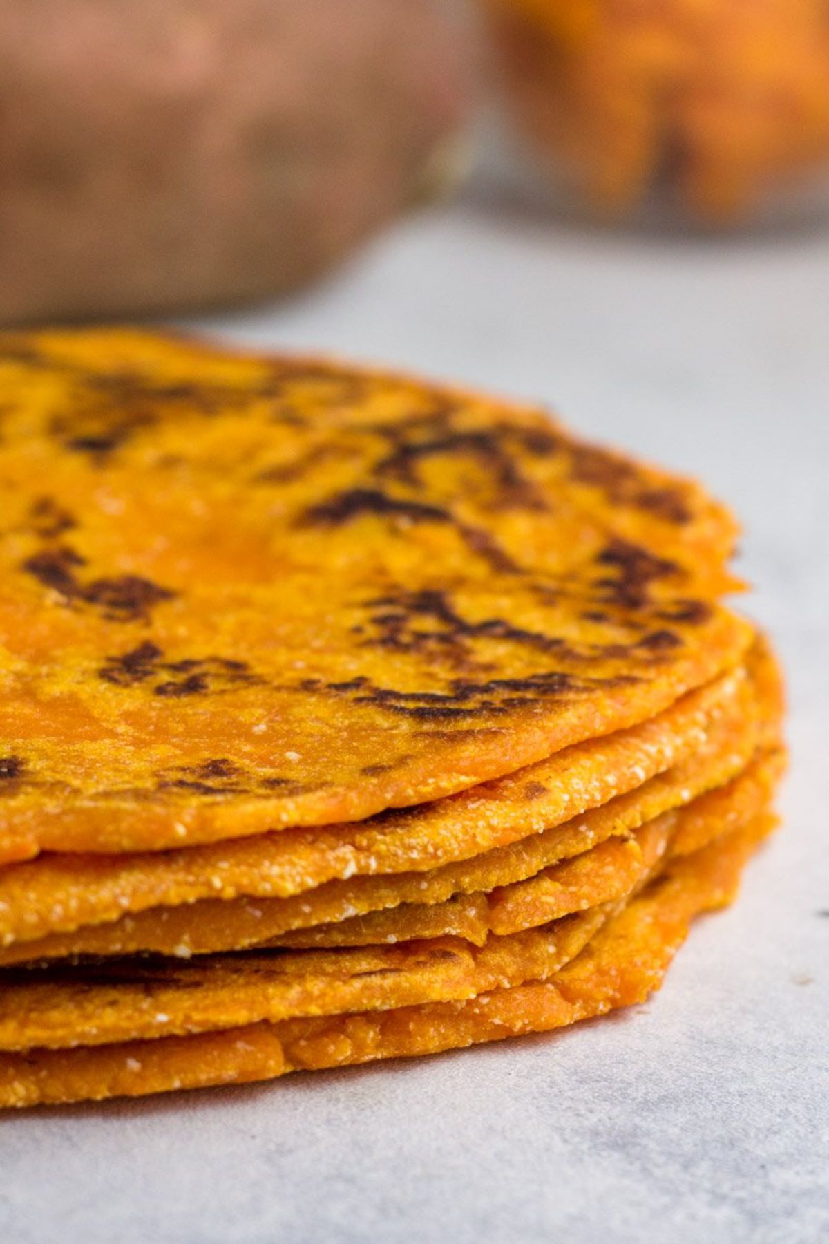 a pile of sweet potato tortillas