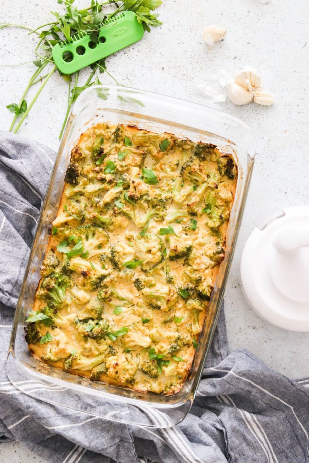 A glass rectangular oven dish with broccoli casseroles inside