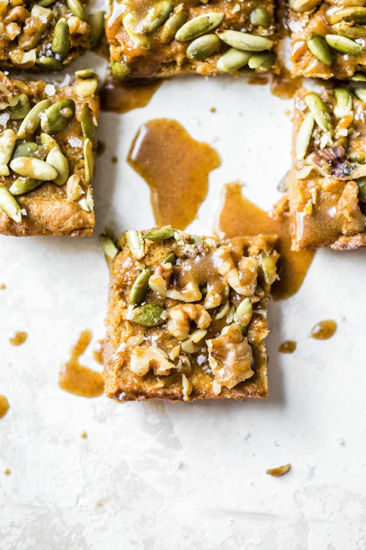 cut squares of sweet potato bars with seeds nad nuts visible