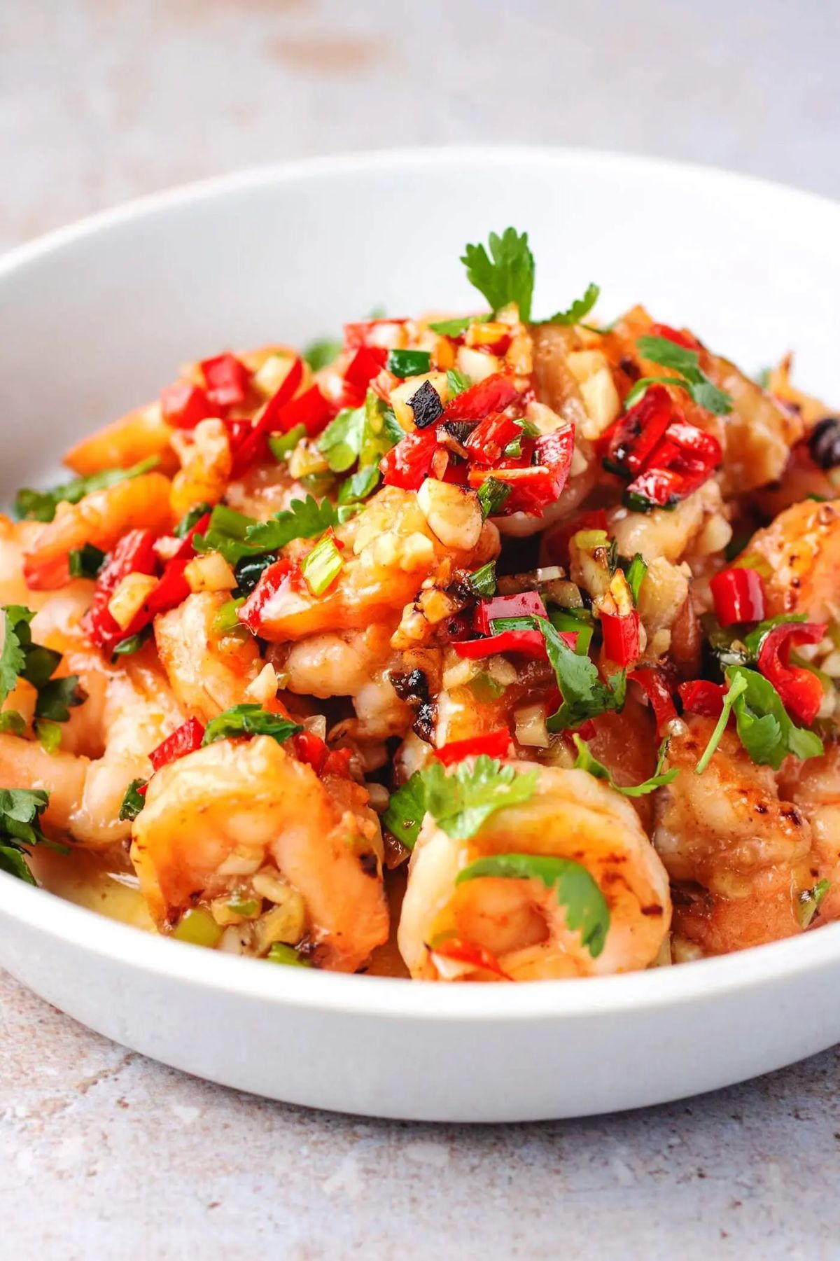 a bowl of shrimp and chopped vegetables