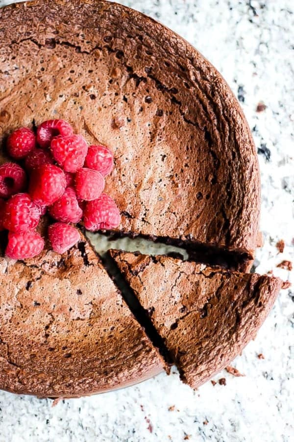 This flourless Chocolate Torte is gluten free and very rich and fudgey. Served with a quick raspberry puree and vanilla ice cream you just can't go wrong.