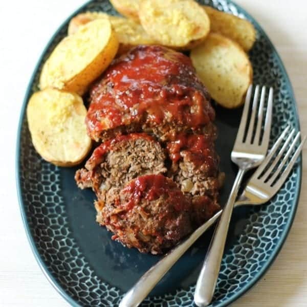 easy paleo meatloaf recipe on a plate with potatoes