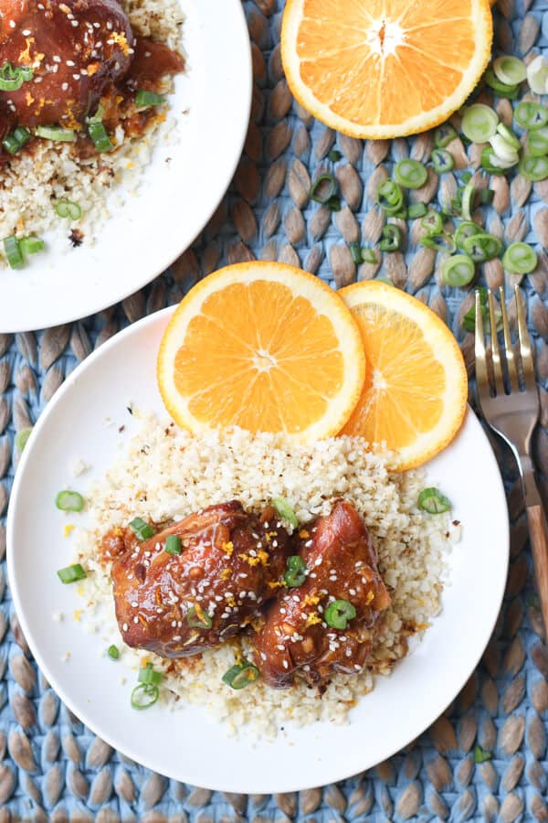 Easy Paleo Crock Pot Slow Cooker Orange Chicken - 2 plates with orange chicken