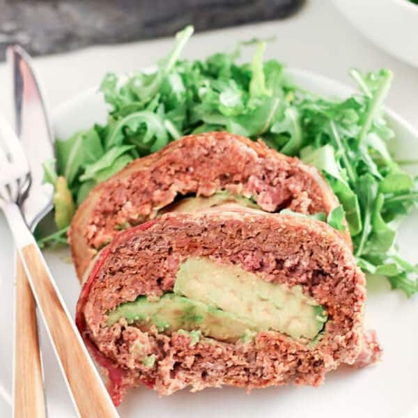 Side Shot of Mexican Style Paleo Meatloaf Stuffed With Avocado and Green Salad