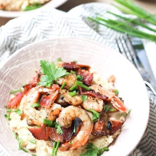 cauliflower shrimp and grits in white bowl