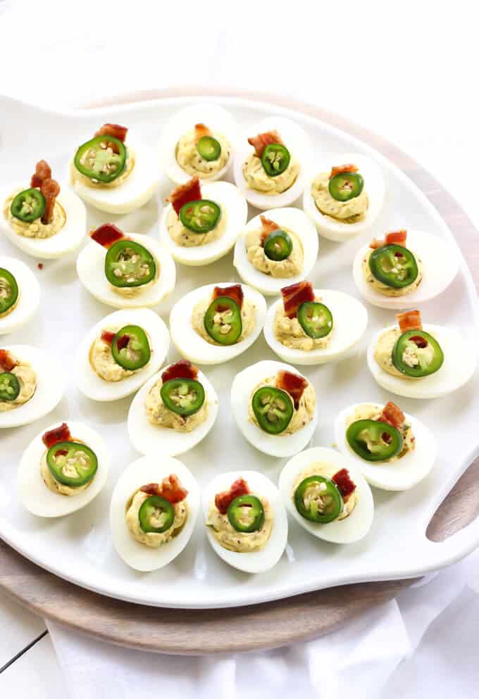 Bacon Jalapeno Deviled Eggs Recipe - Plate filled with deviled eggs