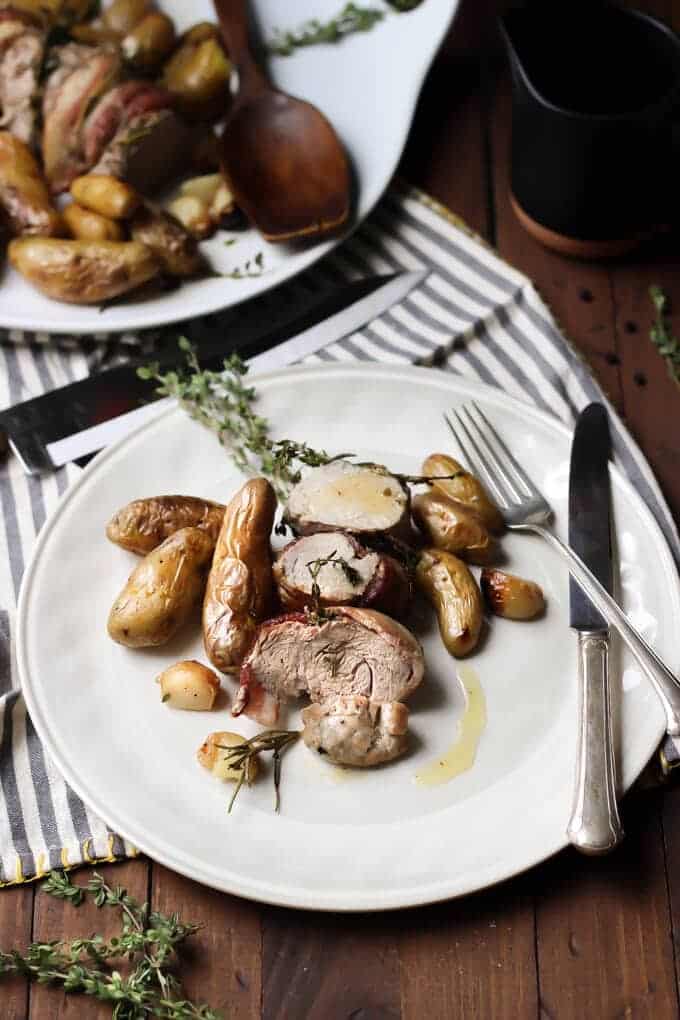 One Pan Herb Roasted Pork Loin, Potatoes, and Garlic meal on plate