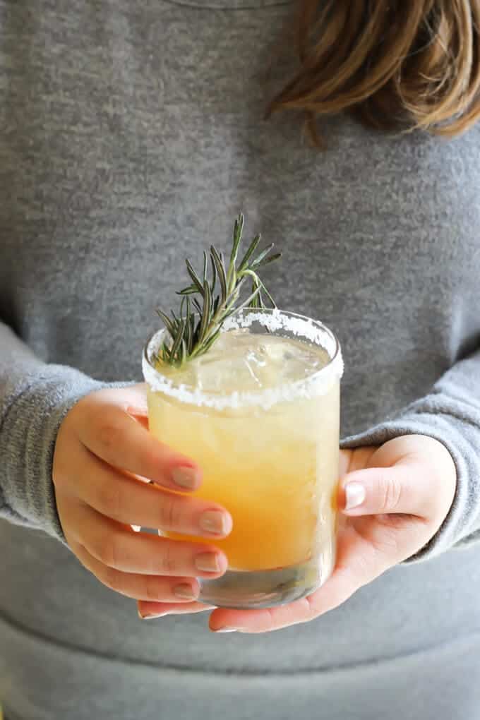 Rosemary Ginger Margarita on hands