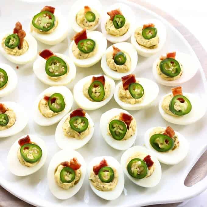 Bacon Jalapeno Deviled Eggs Recipe - Plate full of deviled eggs