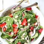 Easy Almond Strawberry Spinach Salad Recipe With Poppy Seed Dressing - Bowl with salad and forks