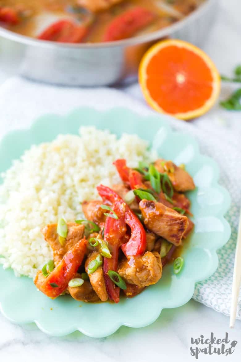 paleo orange chicken closeup on teal plate