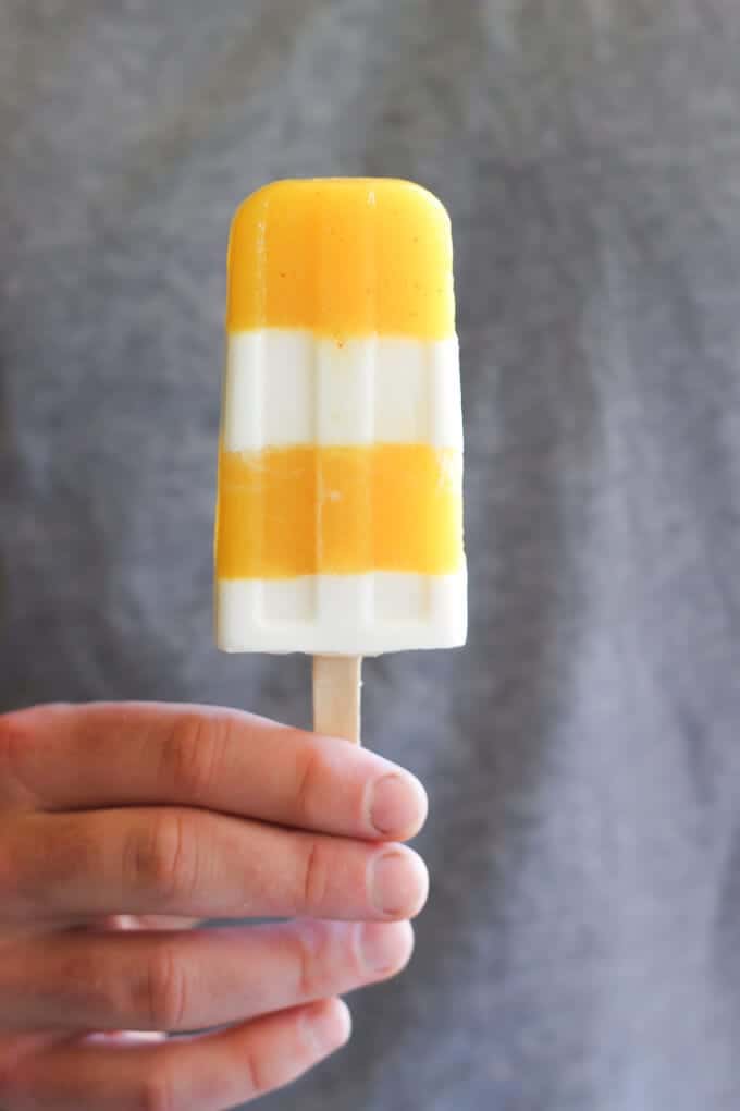 Spicy Mango Margarita Creamsicles in hand