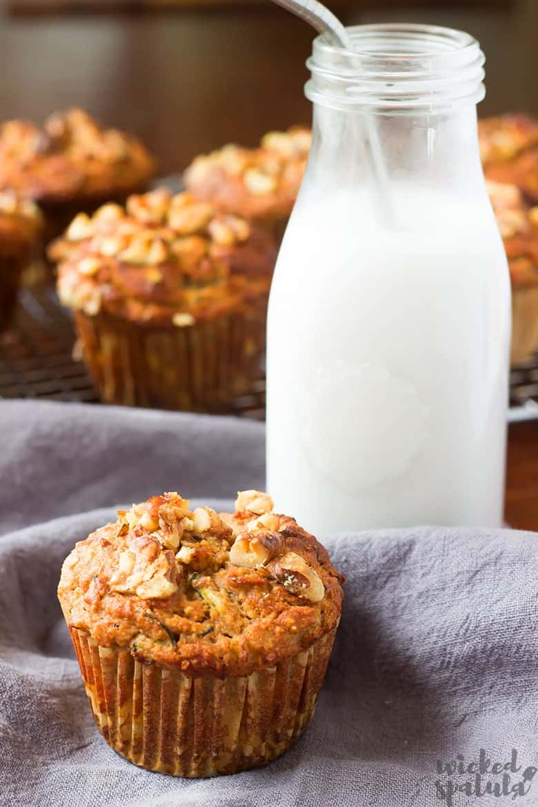 gluten-free zucchini muffin recipe next to glass of almond milk