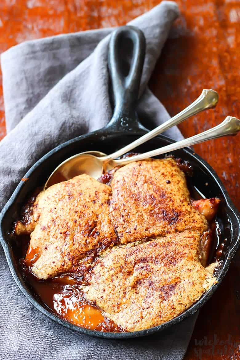 healthy peach cobbler in an iron skillet