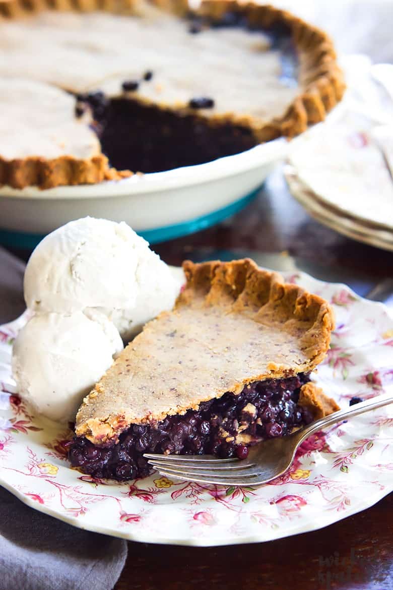 slice of paleo chocolate pie on a plate with ice cream