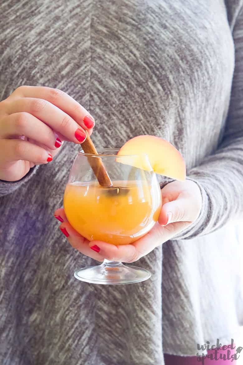 person holding apple cider margarita 