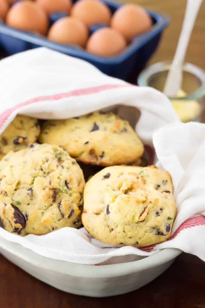 These Easy Paleo Drop Biscuits get jazzed up with olives, caramelized onions, and fresh herbs. Perfect for little sandwiches or a great roll alternative!