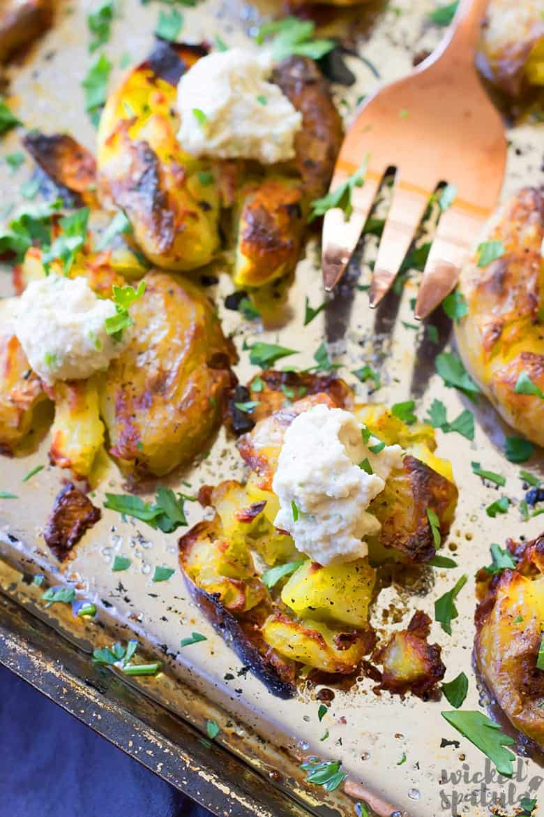 garlic smashed potatoes on a pan