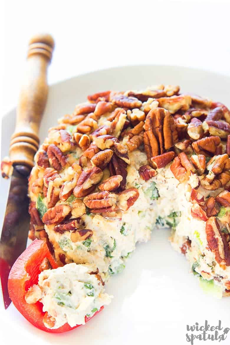 cheese ball on a plate with serving knife