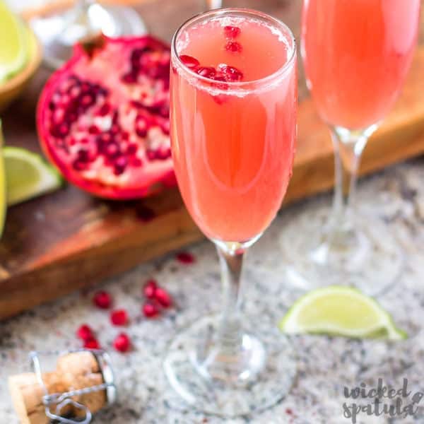 Mexican Pomegranate Mimosas in a champagne glass