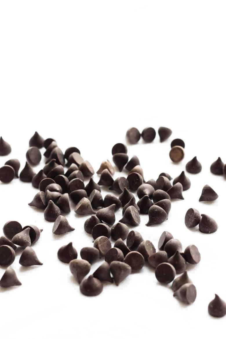 Overhead Shot Of Chocolate Chips on White Background