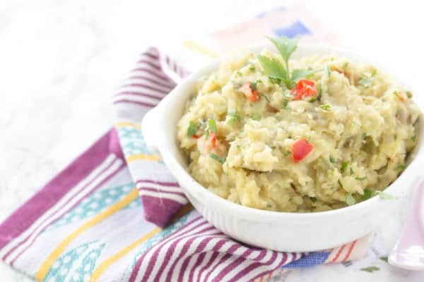 Slow Cooker Mexican Mashed Potatoes - This spin on classic mashed potatoes is spiced up with bell peppers, onions, green chiles, and jalapeños!