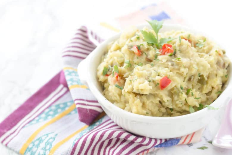 Slow Cooker Mexican Mashed Potatoes - This spin on classic mashed potatoes is spiced up with bell peppers, onions, green chiles, and jalapeños!