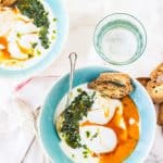 Turkish Poached Eggs - Garlic infused yogurt gets topped with poached eggs, spiced browned butter, and a fragrant chimichurri