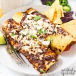 Paleo enchiladas on a plate with chips ready to eat