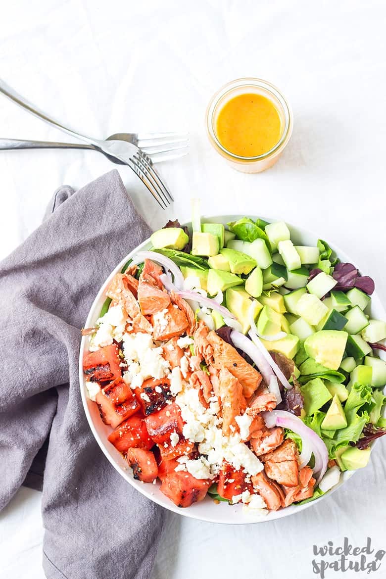 healthy salmon salad with watermelon, cucumbers, avocado