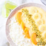 mango smoothie bowl with toppings