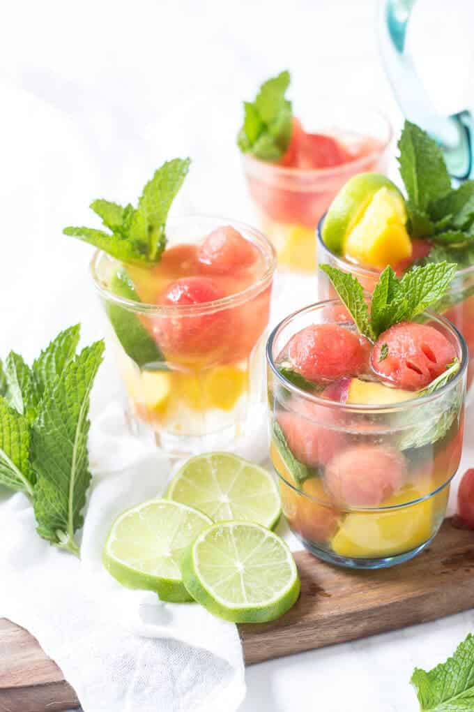 peach sangria in clear glasses with garnish
