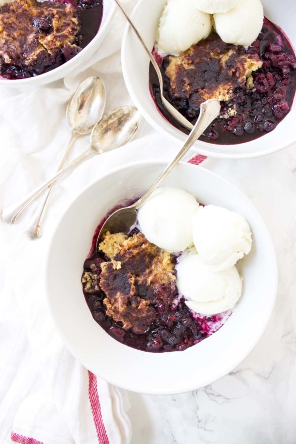 This Slow Cooker Mixed Berry Cobbler has that classic syrupy fruit all topped with a fluffy pastry that gets all mixed up in one bowl.