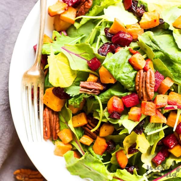fall harvest salad on a plate with a fork