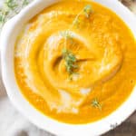 roasted carrot soup in white bowl