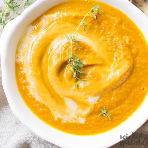 roasted carrot soup in white bowl
