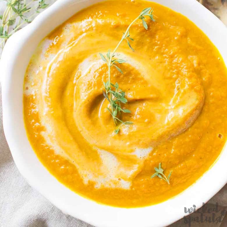 roasted carrot soup in white bowl