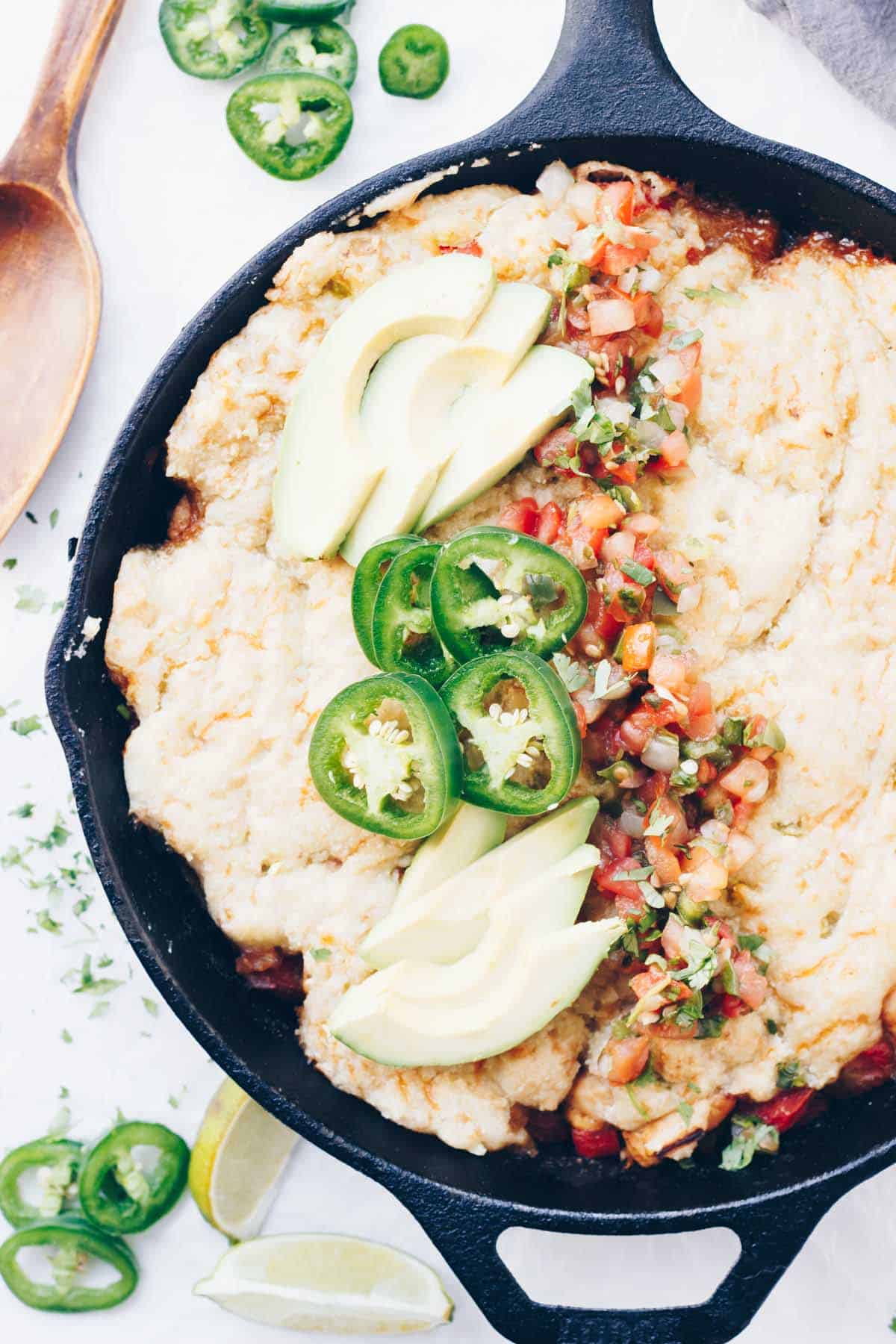 This Primal Taco Pot Pie is packed with chicken, peppers, onions & taco spices. It all gets made in one skillet & the cheesy grain-free crust is delicious!