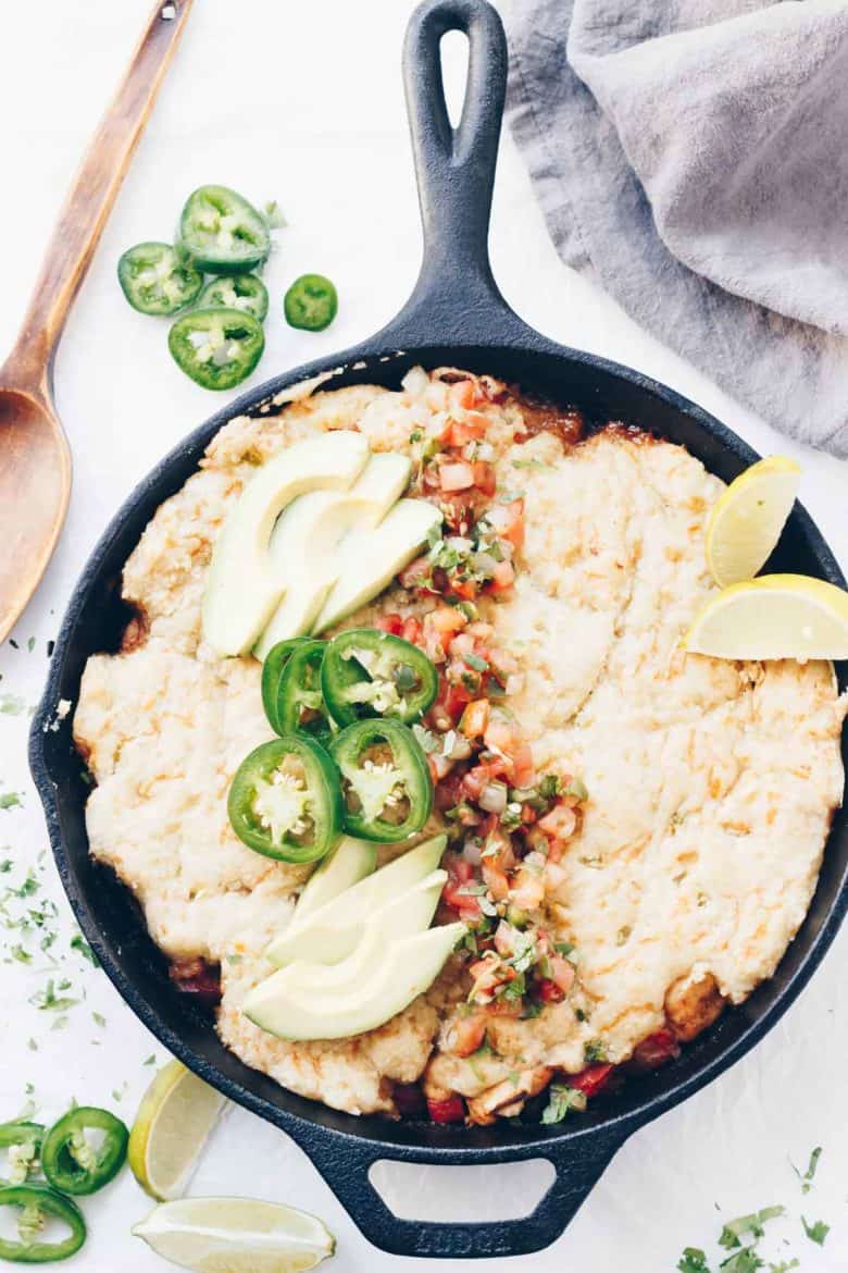 This Primal Taco Pot Pie is packed with chicken, peppers, onions & taco spices. It all gets made in one skillet & the cheesy grain-free crust is delicious!