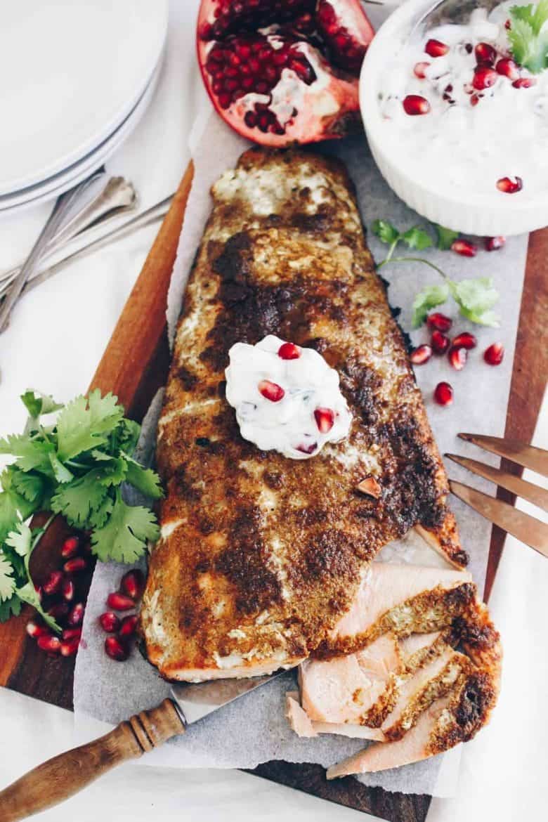 This Tandoori Spiced Salmon with Pomegranate Cucumber Raita is a holiday worthy meal that's bursting with global flavors!