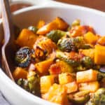 butternut squash and brussels sprouts in a serving dish