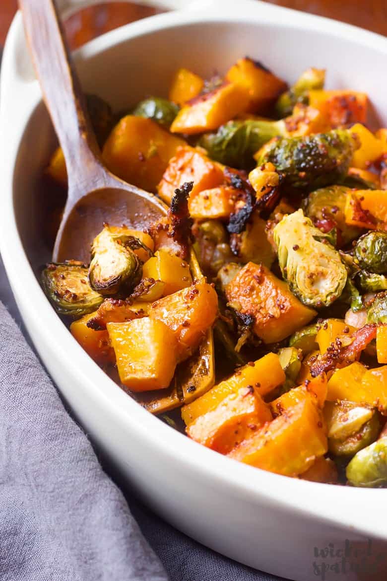 roasted butternut squash and brussels sprouts in a serving dish