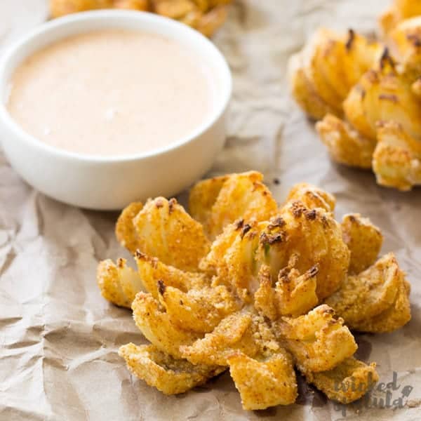 A healthy, easy baked blooming onion recipe - yes, really! I'll teach you how to cut a blooming onion and how to make a blooming onion that's healthy, gluten-free and paleo friendly.