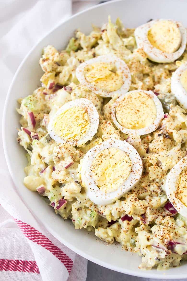 This Cauliflower "Potato" Salad tastes just like the classic potato salad that you're used to, just with way less carbs and healthier ingredients!