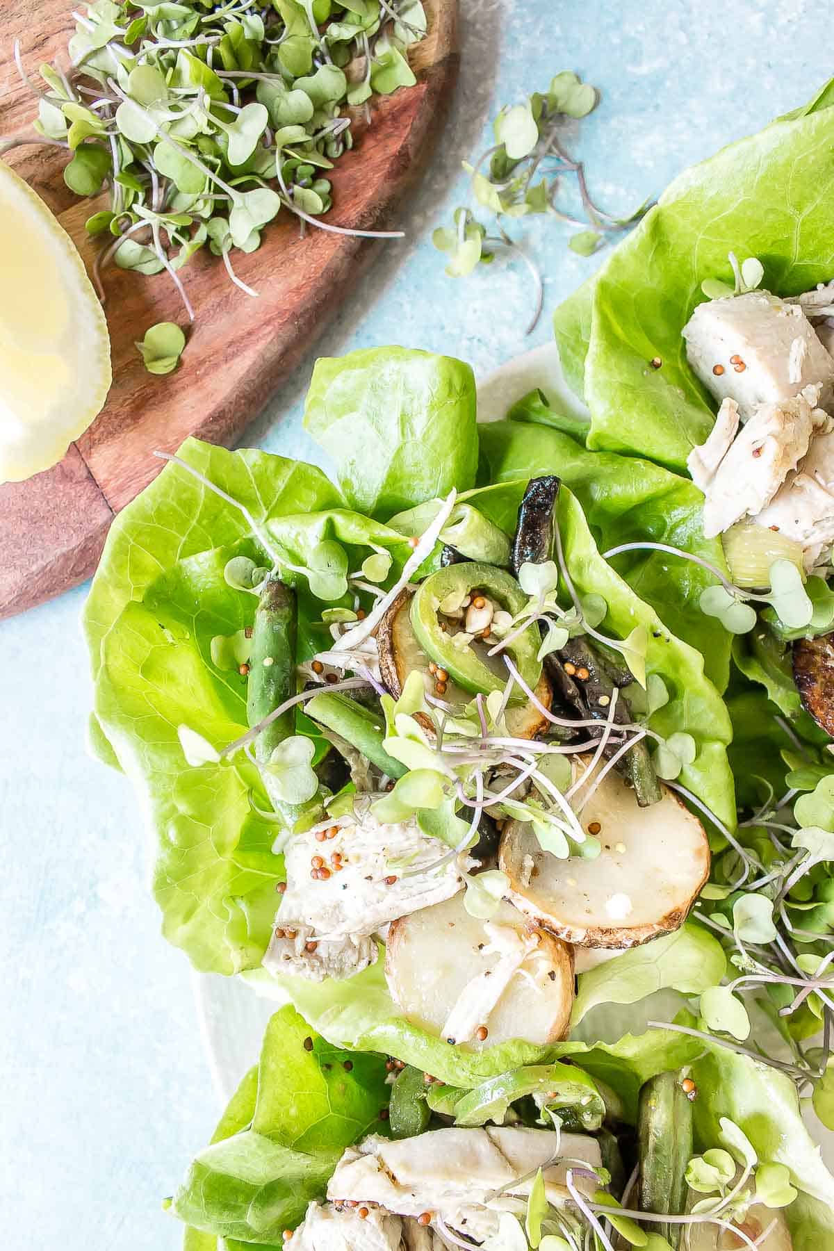 These Chicken, Potato, and Green Bean Lettuce Cups are packed full of flavor from the charred green onions and jalapenos to the tangy mustard dressing.