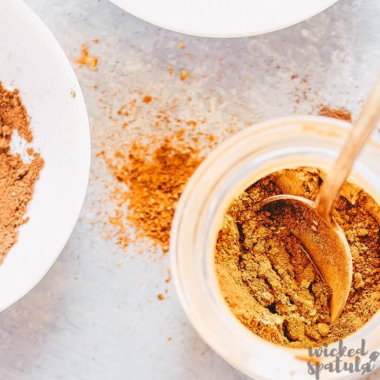 pumpkin pie spice in a bowl with a spoon